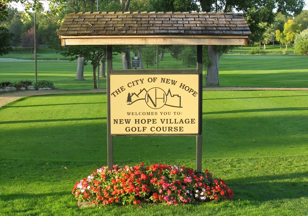 Panoramic view of a lush green golf course at New Hope Village Golf Course. Smooth