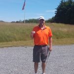 green grass with the flag in the hole.