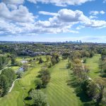 Panoramic view of a lush green golf course at Newton Commonwealth Golf Course. Smooth