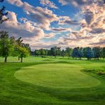 green grass with the flag in the hole.