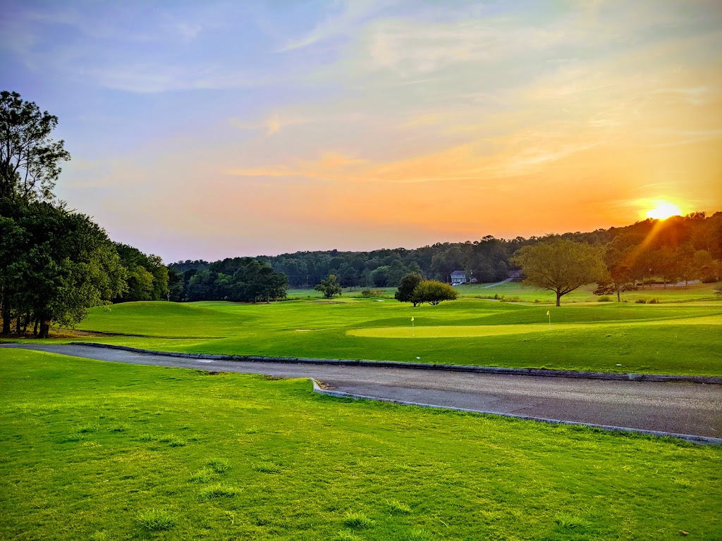 Panoramic view of a lush green golf course at Nob North Golf Course. Smooth