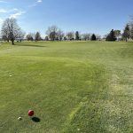 Panoramic view of a lush green golf course at North Bend Golf Course. Smooth