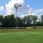 green grass with the flag in the hole.