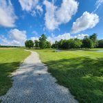 Panoramic view of a lush green golf course at North Branch Golf Course. Smooth