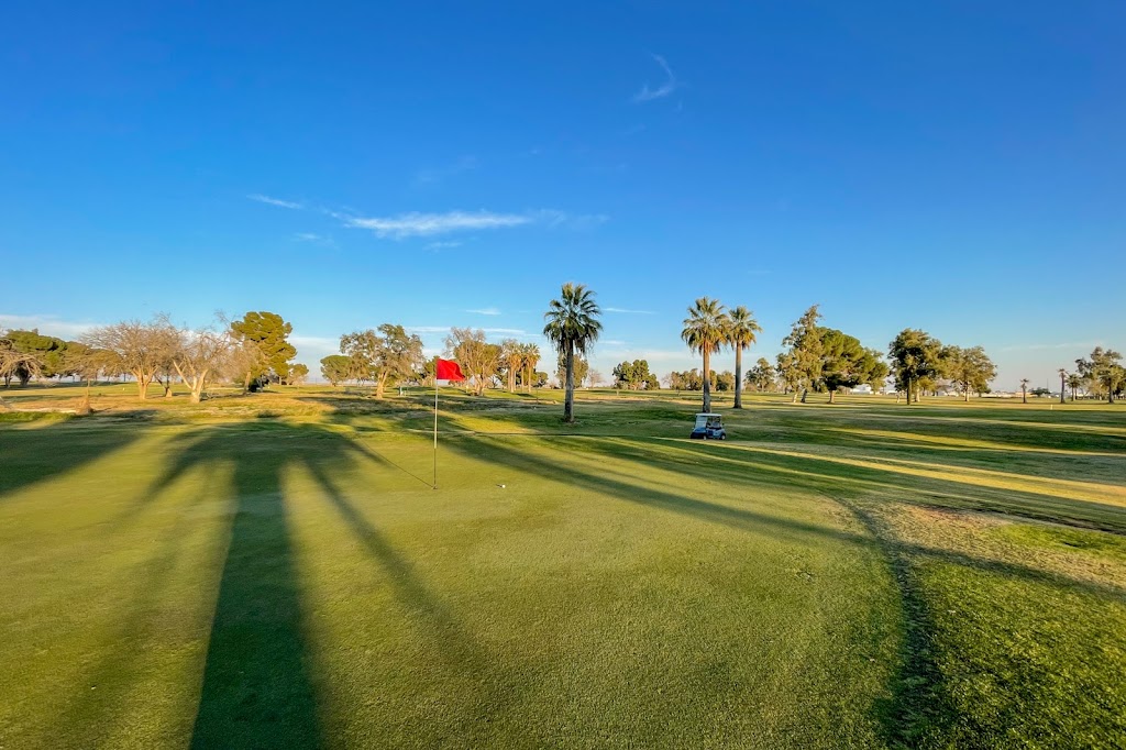 Panoramic view of a lush green golf course at North Kern Golf Course. Smooth