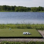Panoramic view of a lush green golf course at North Terra Golf Course. Smooth