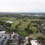 Panoramic view of a lush green golf course at Northern Hills Golf Club. Smooth