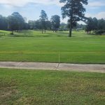 Panoramic view of a lush green golf course at Northwood Hills Country Club. Smooth