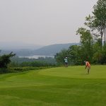 Panoramic view of a lush green golf course at Norway Country Club. Smooth
