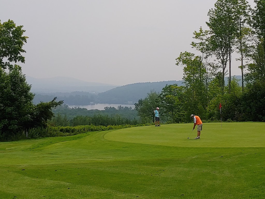Panoramic view of a lush green golf course at Norway Country Club. Smooth
