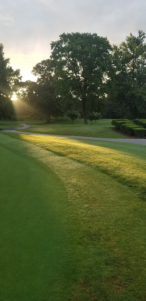 Panoramic view of a lush green golf course at Nutter's Crossing Golf Course. Smooth