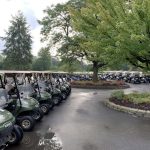 Panoramic view of a lush green golf course at Oak Brook Golf Club. Smooth