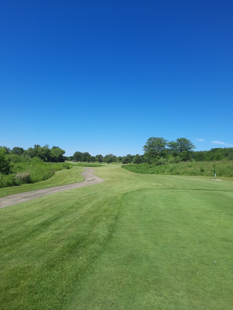 Panoramic view of a lush green golf course at Oak Grove Golf Course. Smooth