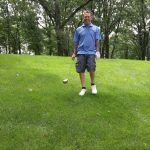 green grass with the flag in the hole.