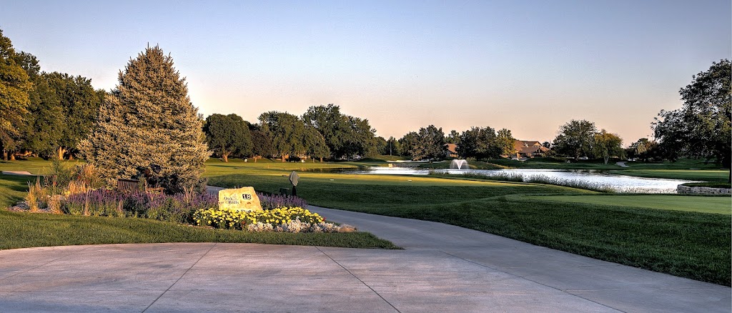 Panoramic view of a lush green golf course at Oak Hills Country Club. Smooth