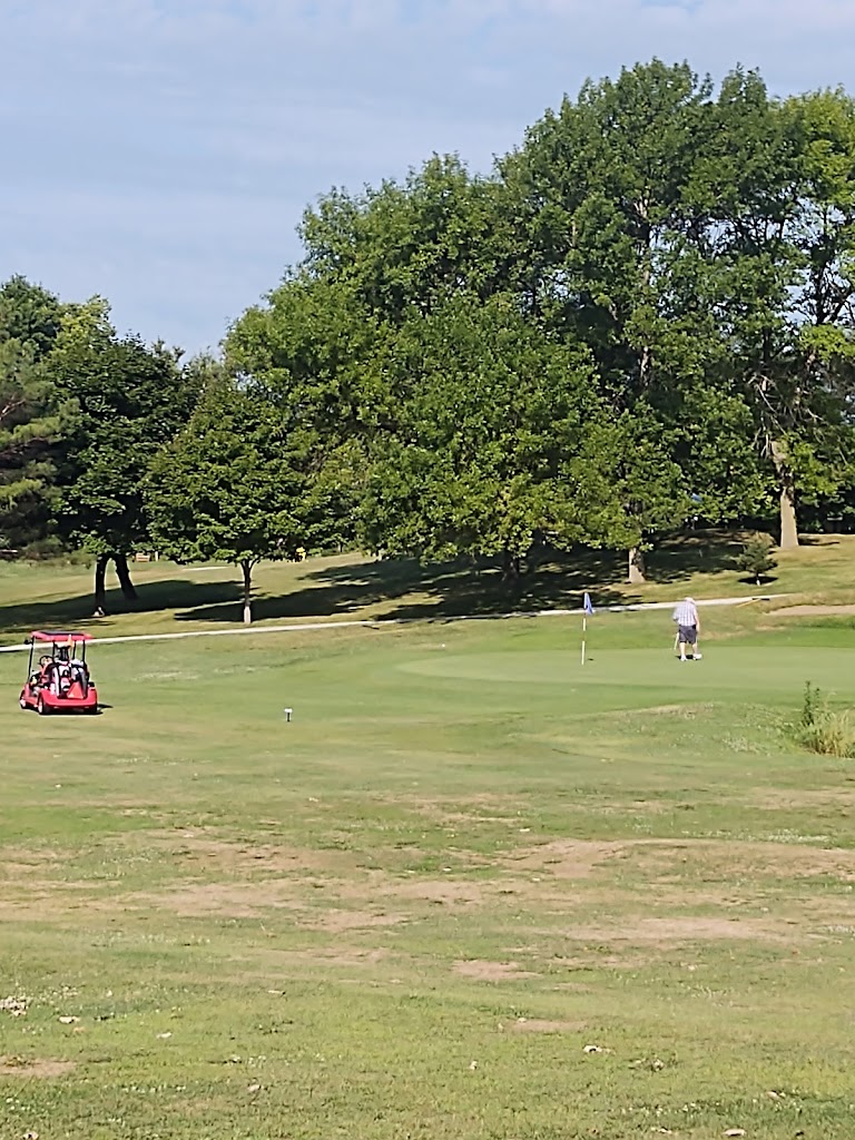Panoramic view of a lush green golf course at Oak Hills Par 30 Public Golf Course. Smooth