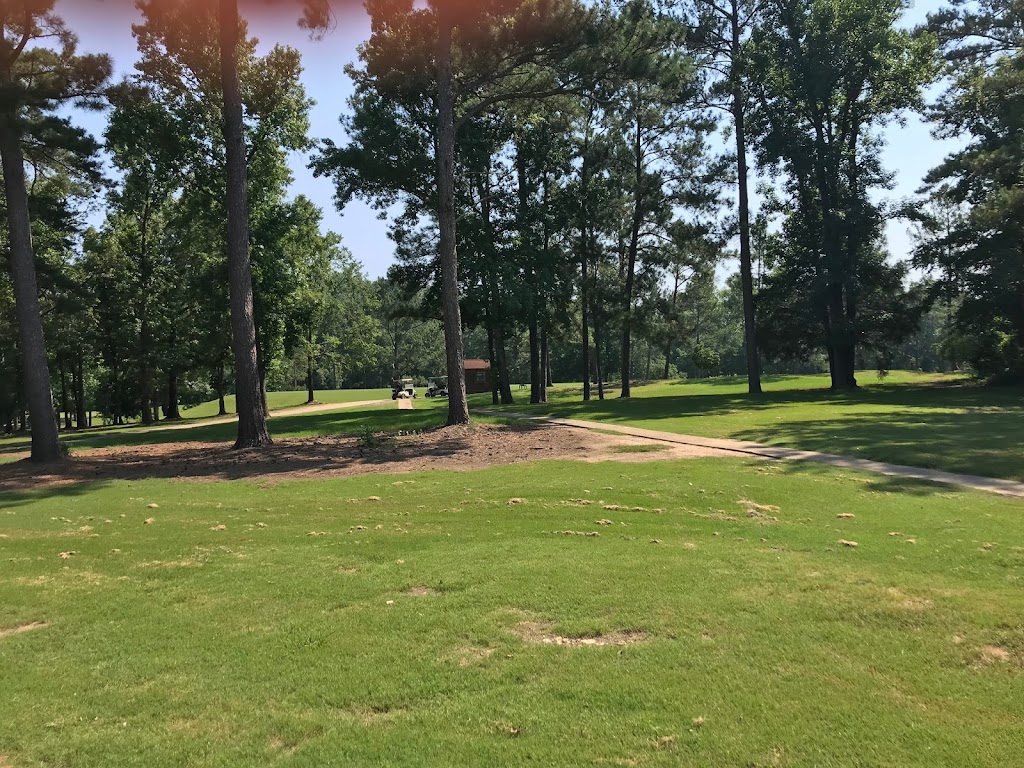 Panoramic view of a lush green golf course at Oak Mountain Golf Course. Smooth