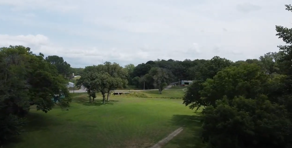 Panoramic view of a lush green golf course at Oak Park Golf & Recreation. Smooth