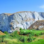 Panoramic view of a lush green golf course at Oak Quarry Golf Club. Smooth