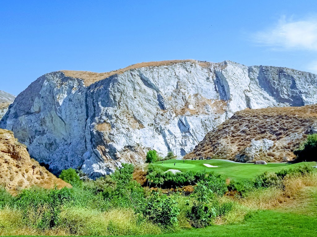 Panoramic view of a lush green golf course at Oak Quarry Golf Club. Smooth