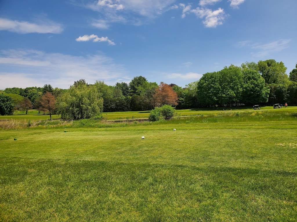 Panoramic view of a lush green golf course at Oak Ridge Golf Club. Smooth