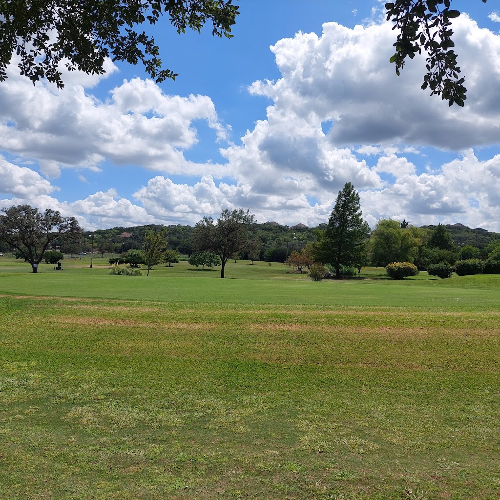 Panoramic view of a lush green golf course at Oak Valley Golf Course. Smooth