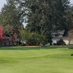 Panoramic view of a lush green golf course at Oakbrook Golf Club. Smooth