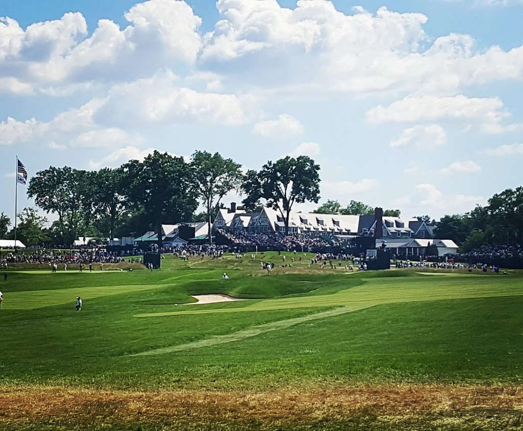 Panoramic view of a lush green golf course at Oakmont Country Club. Smooth