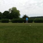 green grass with the flag in the hole.