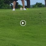 green grass with the flag in the hole.