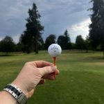 green grass with the flag in the hole.