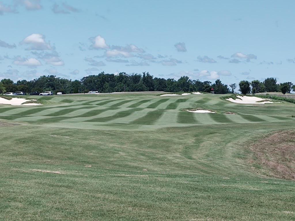 Panoramic view of a lush green golf course at Occano. Smooth