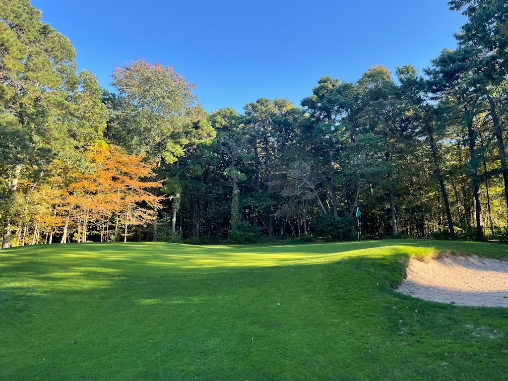 Panoramic view of a lush green golf course at Ocean County Golf Course at Forge Pond. Smooth