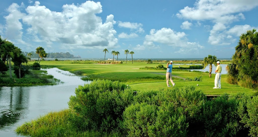 Panoramic view of a lush green golf course at Ocean Point Golf Links. Smooth