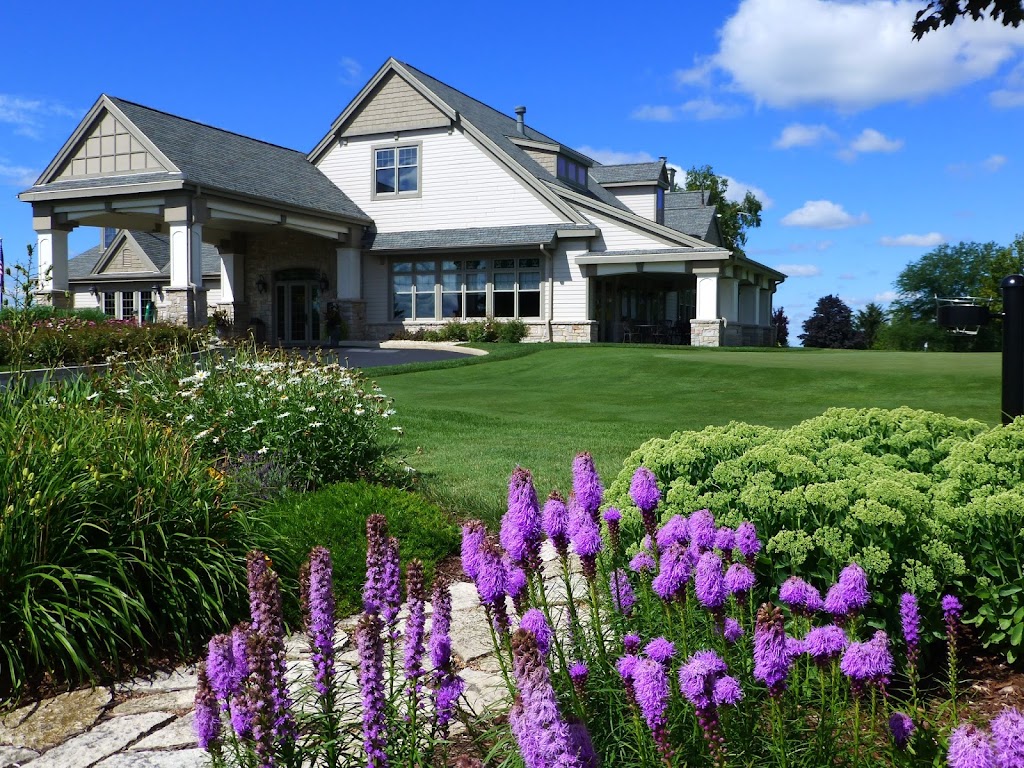 Panoramic view of a lush green golf course at Oconomowoc Golf Club. Smooth