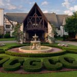 Panoramic view of a lush green golf course at Oklahoma City Golf & Country Club. Smooth