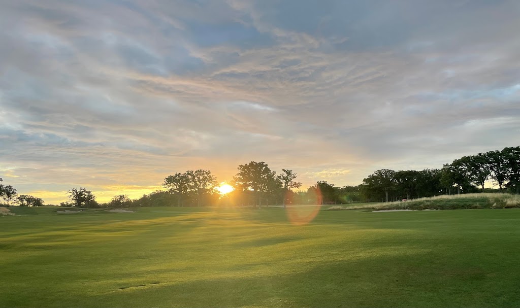 Panoramic view of a lush green golf course at Old Elm Club. Smooth
