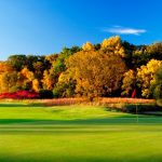 Panoramic view of a lush green golf course at Old Hickory Golf Club. Smooth