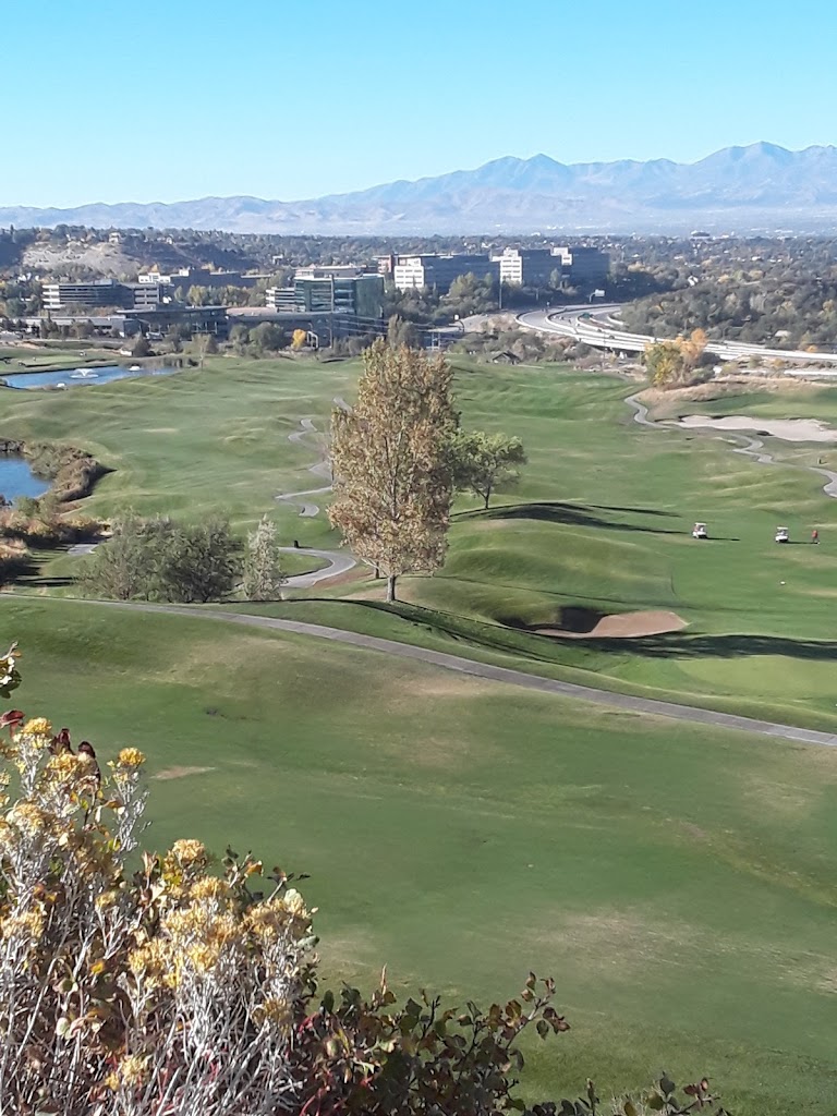 Panoramic view of a lush green golf course at Old Mill Golf Course. Smooth