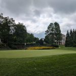 Panoramic view of a lush green golf course at Old Oakland Golf Club. Smooth
