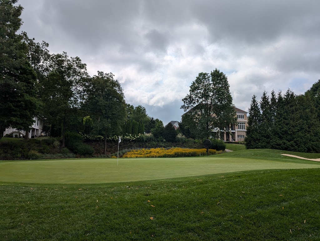 Panoramic view of a lush green golf course at Old Oakland Golf Club. Smooth