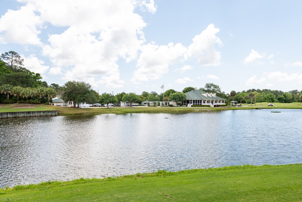 Panoramic view of a lush green golf course at Old South Golf Links. Smooth