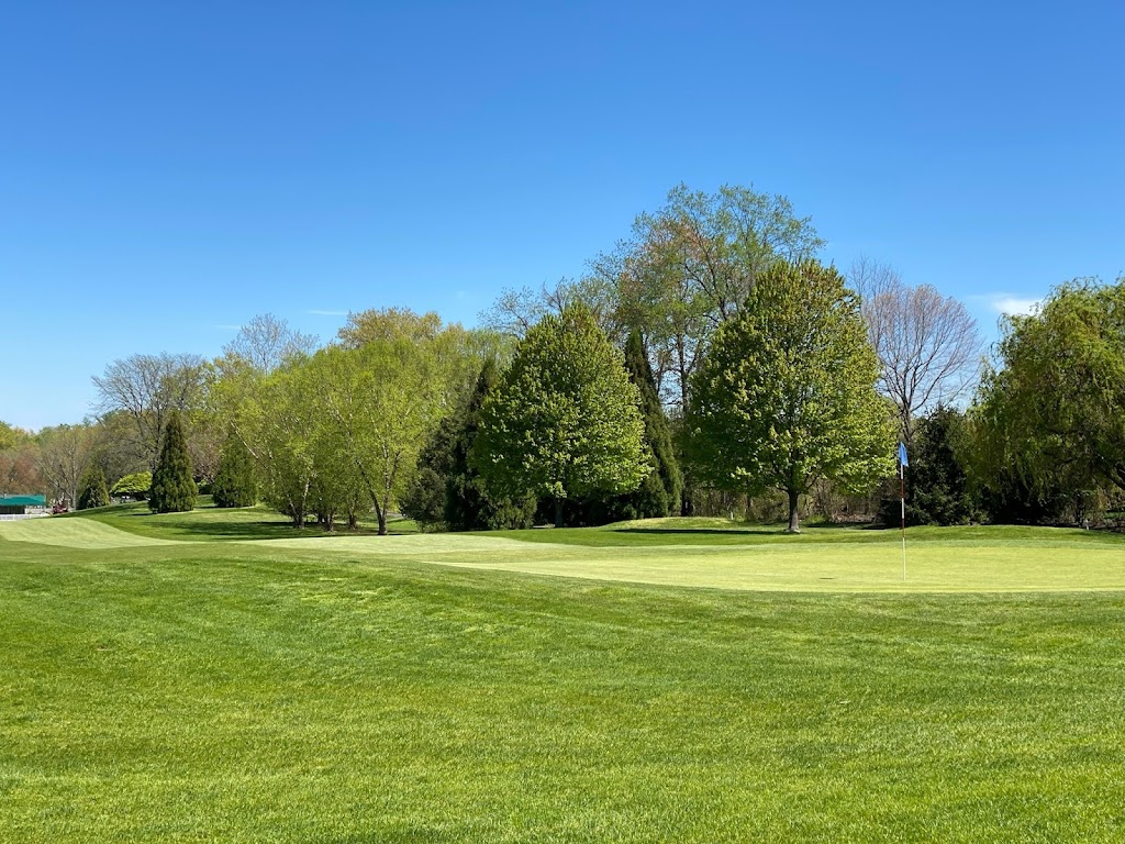 Panoramic view of a lush green golf course at Old Tappan Golf Course. Smooth