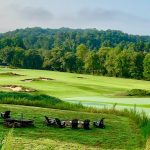 Panoramic view of a lush green golf course at Old Toccoa Farm. Smooth