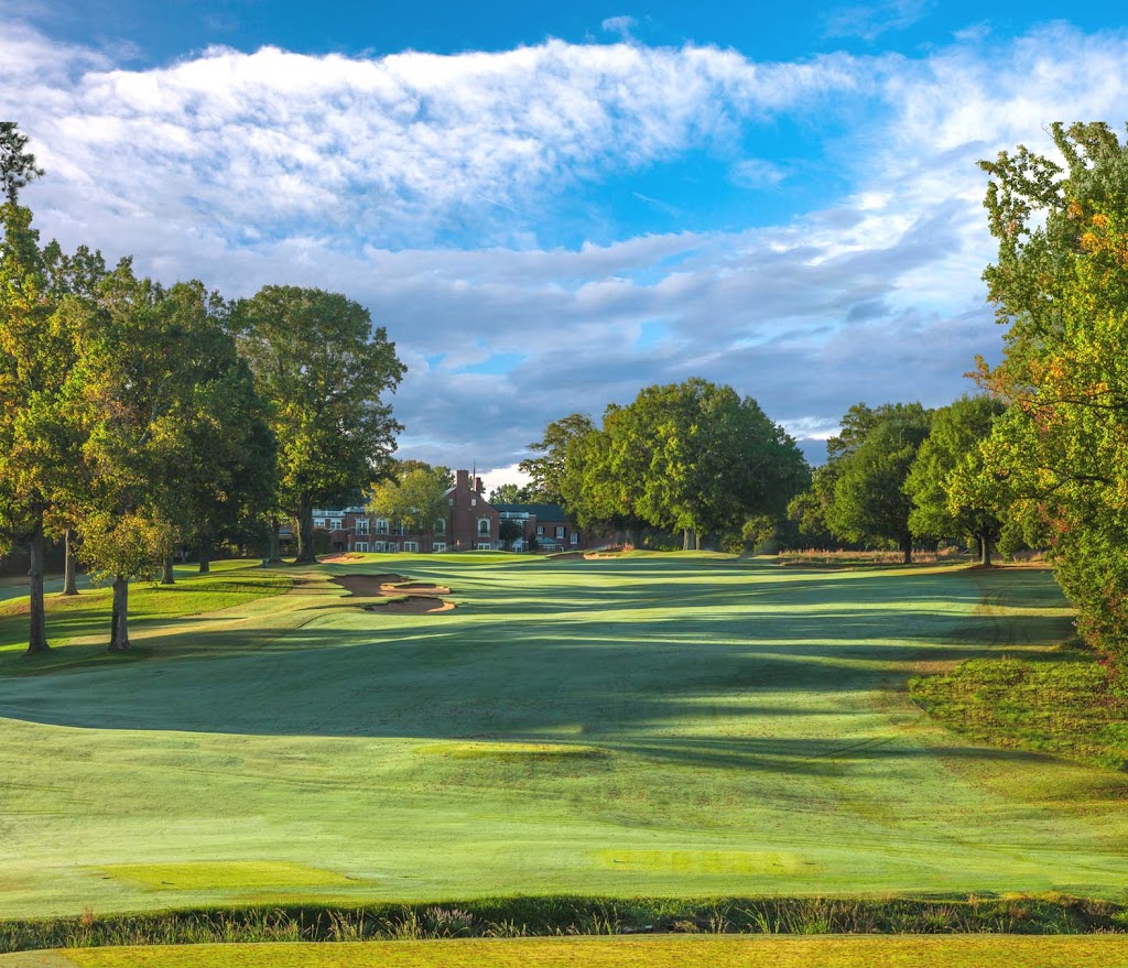 Panoramic view of a lush green golf course at Old Town Club. Smooth