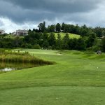 Panoramic view of a lush green golf course at Old Union Golf Course. Smooth