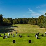 Panoramic view of a lush green golf course at Olde Atlanta Golf Club. Smooth