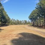 Panoramic view of a lush green golf course at Olde Fort Golf Course. Smooth