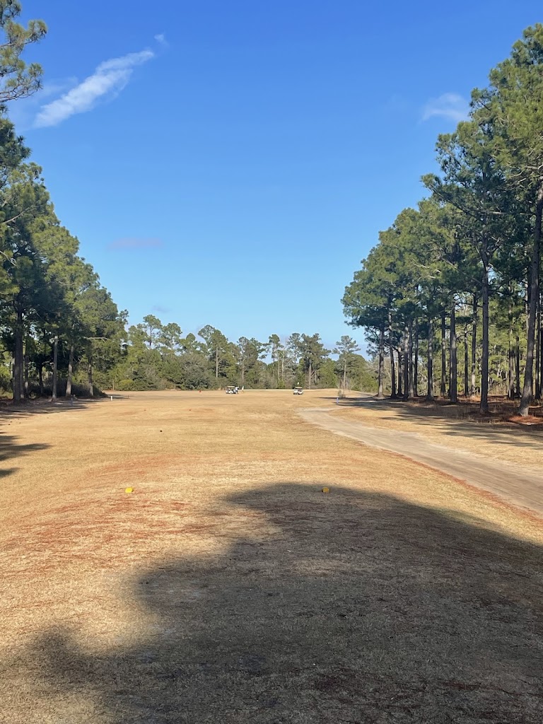 Panoramic view of a lush green golf course at Olde Fort Golf Course. Smooth