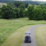Panoramic view of a lush green golf course at Olde Homestead Golf Club. Smooth